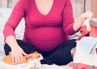 Pregnant mother packing her hospital bag