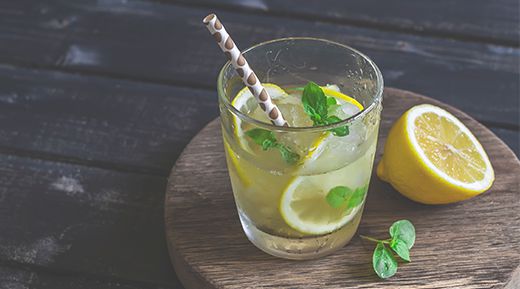 a glass of iced lemonade and mint