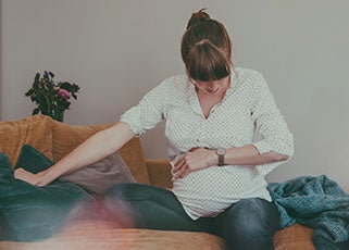 pregnant mother experiencing contractions and about to go into labour