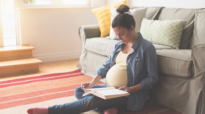 pregnant-mother-reading-book