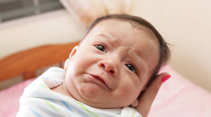 Newborn displaying discomfort