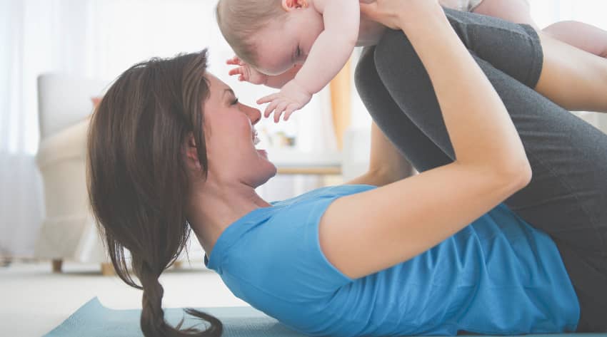 Mother exercising with baby