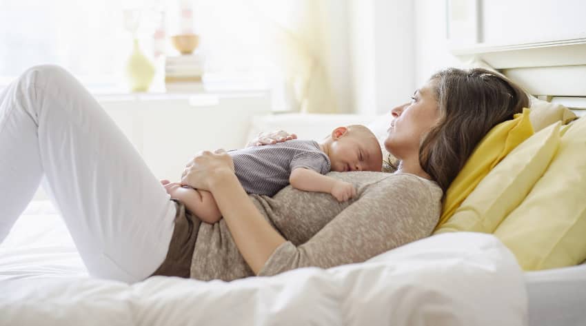 New mom holding newborn on her chest