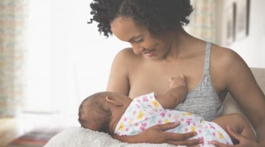 Mother breastfeeding newborn