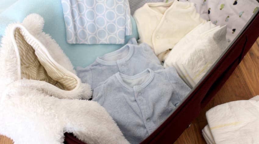 Baby clothes in suitcase