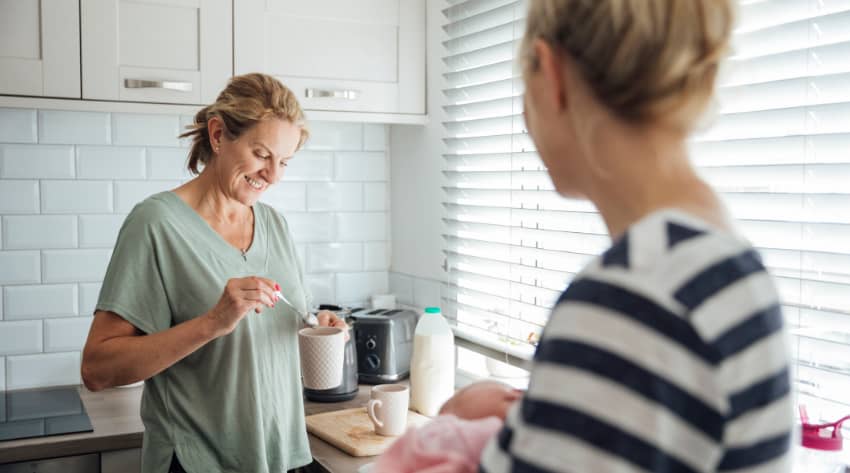 Mum and daughter talking over a cup of tea