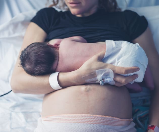 mother-breastfeeding-newborn-after-c-section