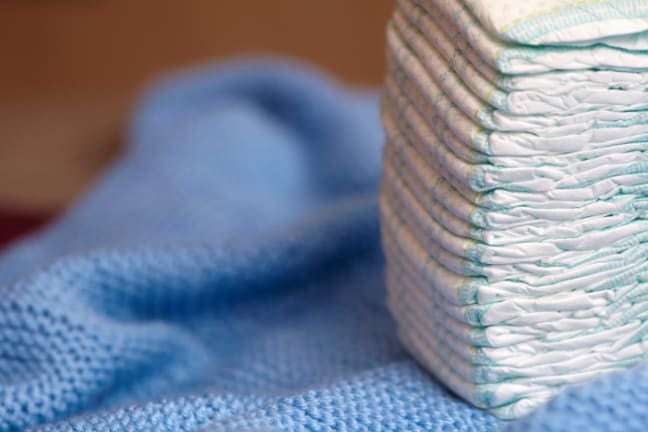 a pile of nappies on a blue blanket