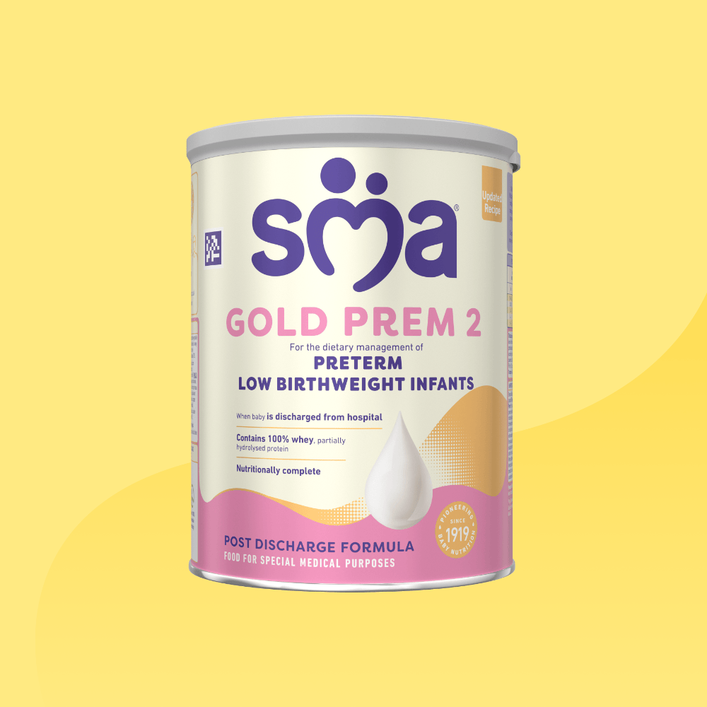 Tin of SMA Gold prem 2 Formula Powder, with a grey lid, in front of a yellow background