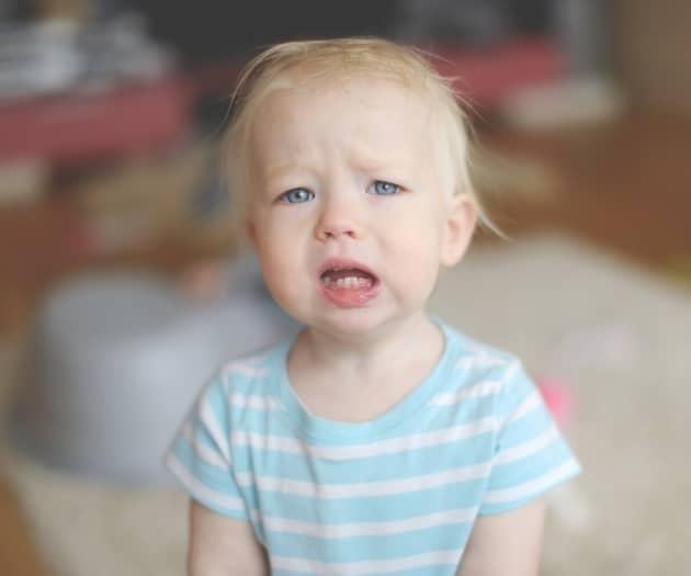 A child looking uncomfortable