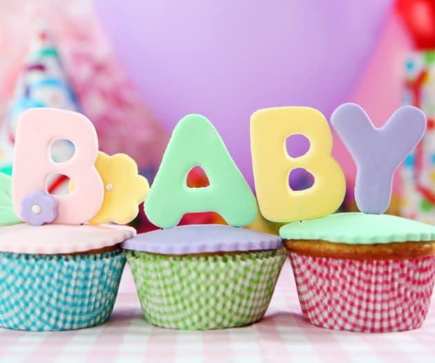Cup cakes with baby decorations